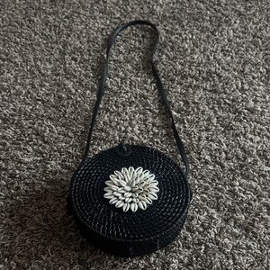 Black Woven Crossbody Bag with Shell Accent